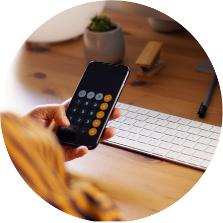 Person using the calculator app on their iPhone