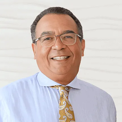 Dr. JB Martin IV, pediatric dentist at ICON Pediatric Dentistry & Orthodontics, smiling in professional attire, showcasing his friendly demeanor and commitment to children's oral health.