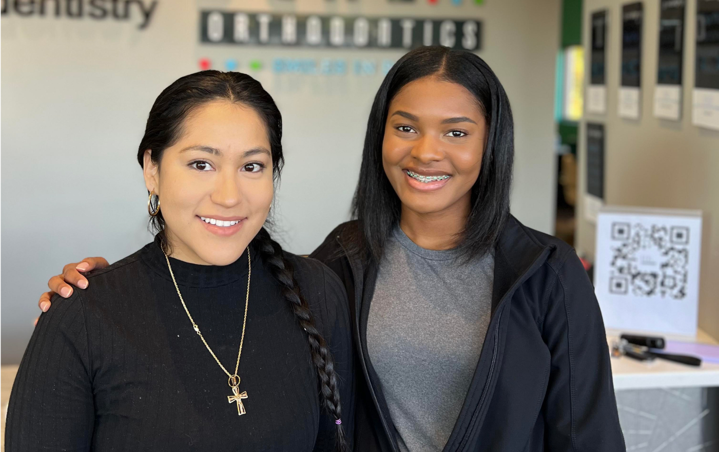 Two happy patients smiling at Behl Orthodontics